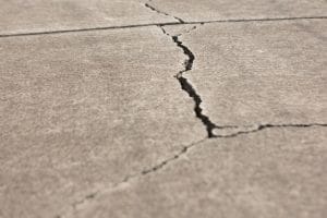 Parking lot maintenance by crack sealing